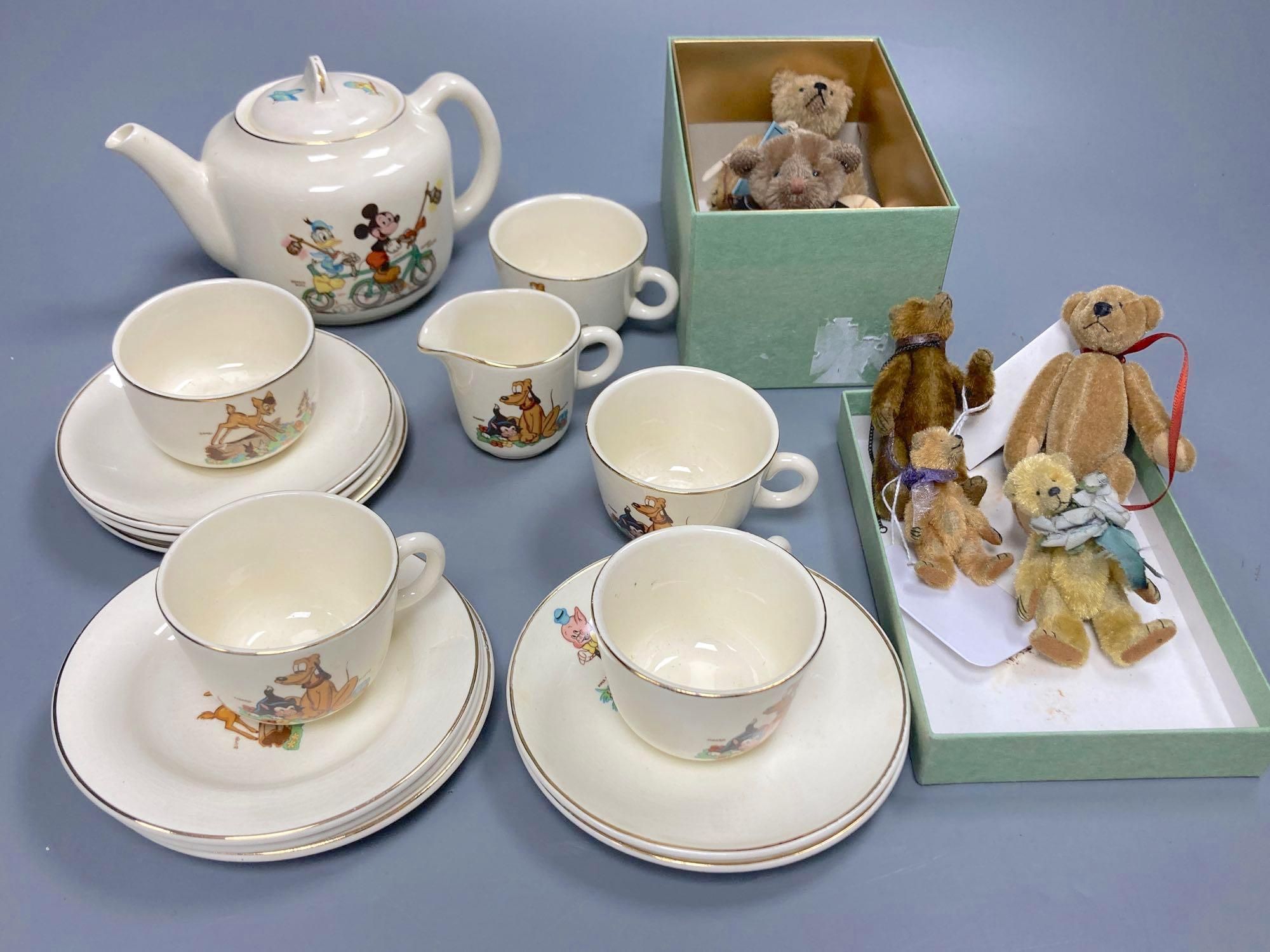 A Beswick Walt Disney 15-piece childs tea service and six small and miniature collectors teddy bears,